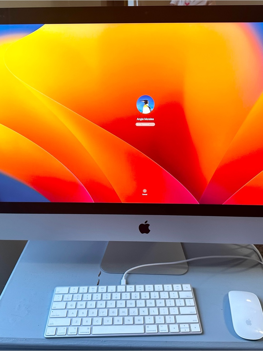 Apple iMac with Orange and Red Display, Silver Body, White Accessories